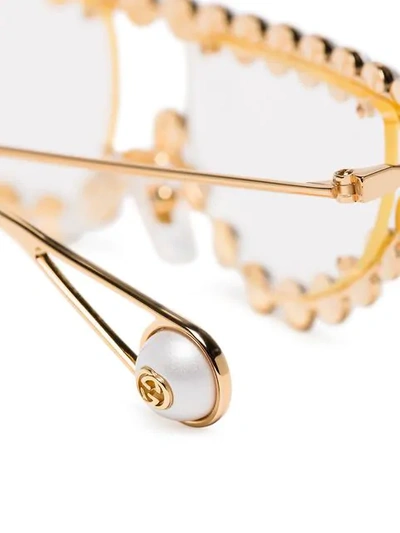 Shop Gucci Gold Toned Pearl Embellished Cat Eye Sunglasses In Gold ,white