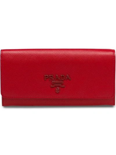 Shop Prada Large Saffiano Leather Wallet In Red