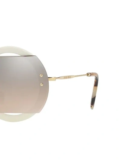 Shop Miu Miu Circle Sunglasses In Neutrals