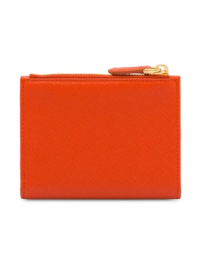 Shop Prada Logo-plaque Top-zip Wallet In Orange