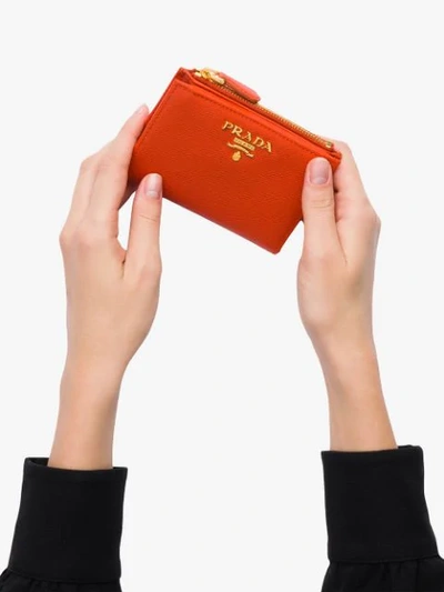 Shop Prada Logo-plaque Top-zip Wallet In Orange