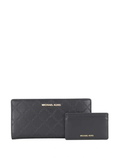 Shop Michael Michael Kors Embossed Logo Wallet In Black