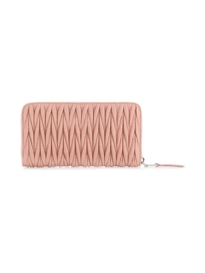 Shop Miu Miu Matelassé Zipped Wallet In Pink