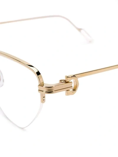 Shop Cartier Cat Eye Glasses In Gold