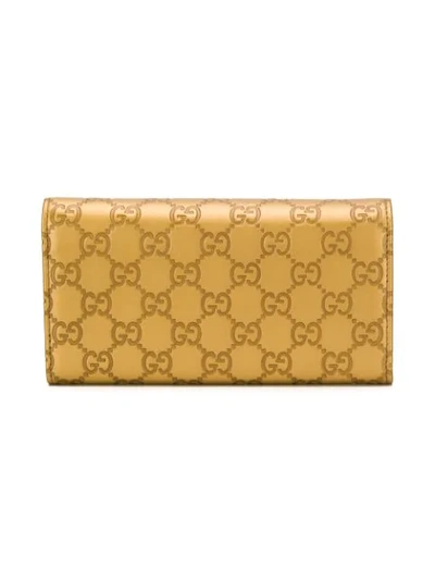Shop Gucci Gg Motif Wallet In Gold