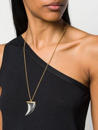 Shop Saint Laurent Horn Pendant Necklace In Gold