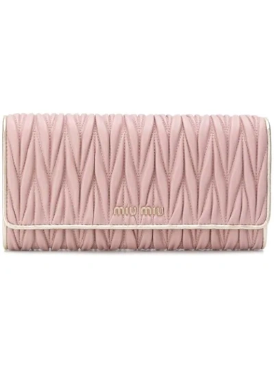 Shop Miu Miu Matelassé Foldover Wallet In Pink