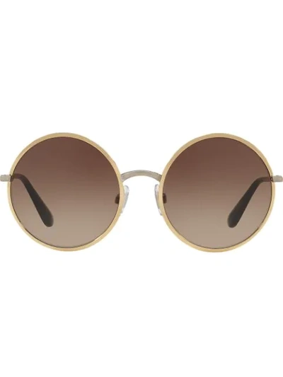 Shop Dolce & Gabbana Round Sunglasses In Gold