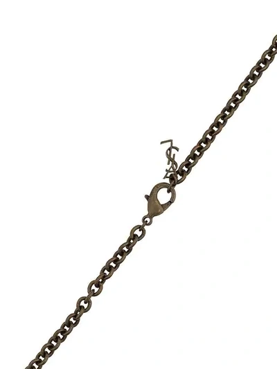 Shop Saint Laurent Logo-embossed Dagger Pendant Necklace In Metallic