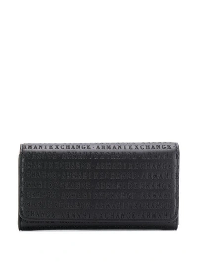 Shop Armani Exchange Logo Embossed Wallet In Black