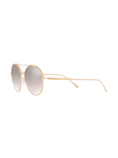Shop Prada Round Shaped Sunglasses In Metallic