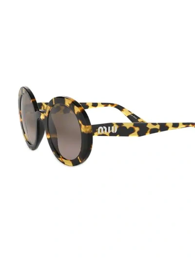 Shop Miu Miu Oversized Round Sunglasses In Brown