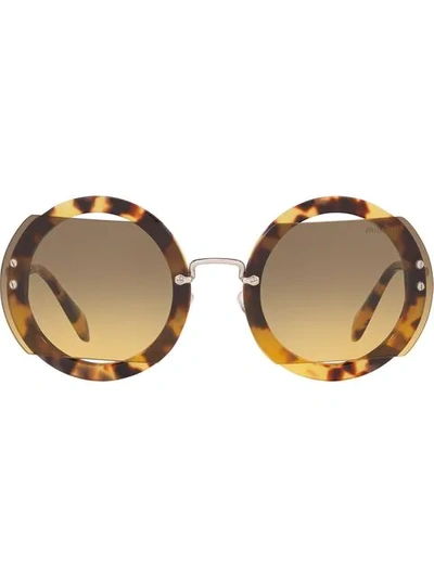 Shop Miu Miu Reveal Sunglasses In Brown