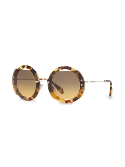 Shop Miu Miu Reveal Sunglasses In Brown