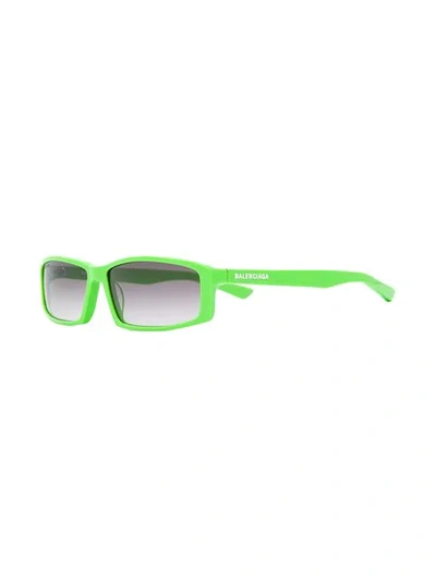 Shop Balenciaga Rectangular Sunglasses In 3512 Green