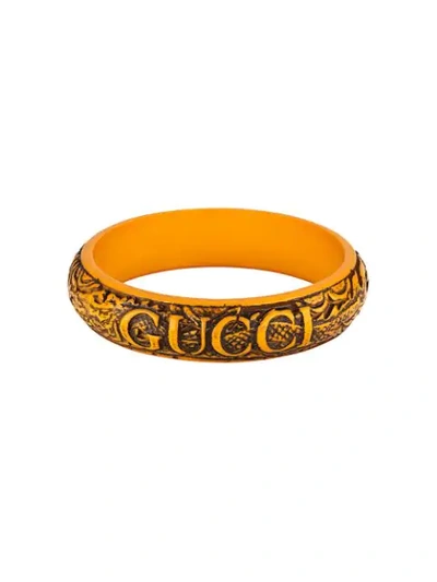 Shop Gucci Logo Carved Bangle In Orange