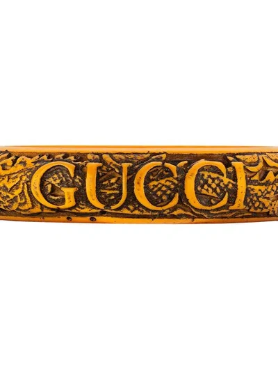 Shop Gucci Logo Carved Bangle In Orange