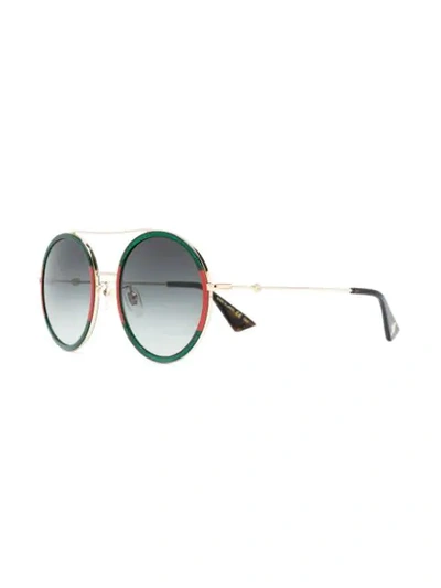 Shop Gucci Round Frame Sunglasses In Metallic