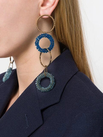 Shop Jacquemus Interlaced Hoops Drop Earrings In Gold