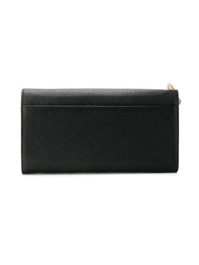 Shop Dkny Pebbled Large Carryall Wallet In Black