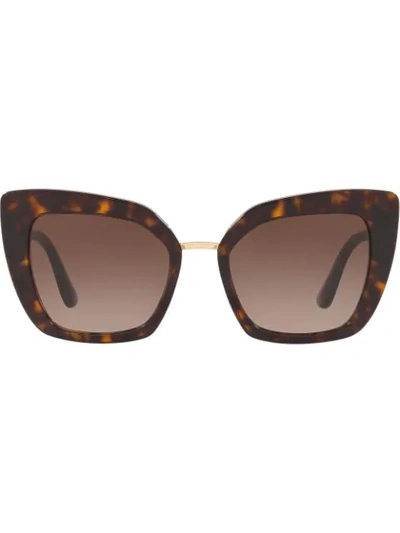 Shop Dolce & Gabbana Cate Eye Sunglasses In Brown