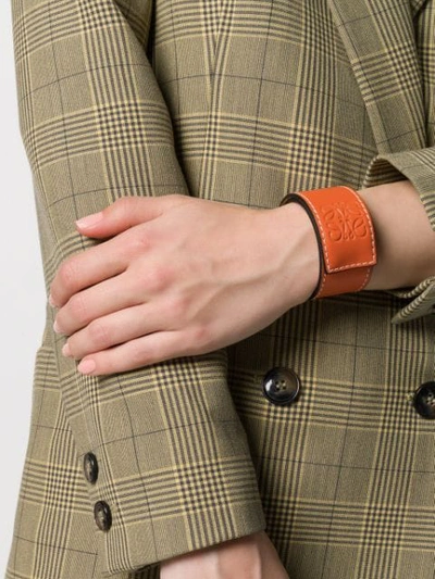 Shop Loewe Embossed Logo Bracelet In Orange