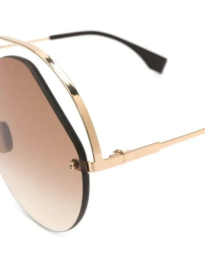 Shop Fendi Round Frame Sunglasses In Gold