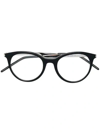 Shop Saint Laurent Round Framed Glasses In 002 Black
