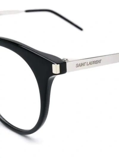 Shop Saint Laurent Round Framed Glasses In 002 Black