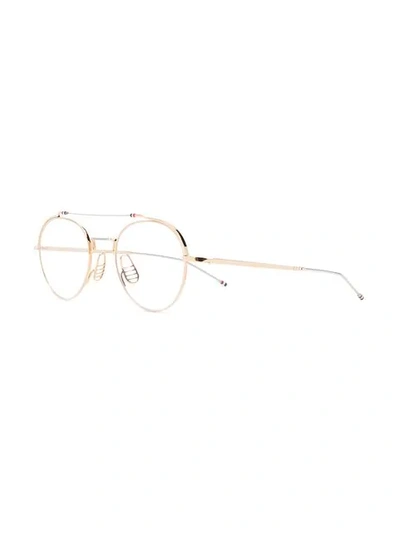 Shop Thom Browne Eyewear Rounded Clear Glasses - Gold