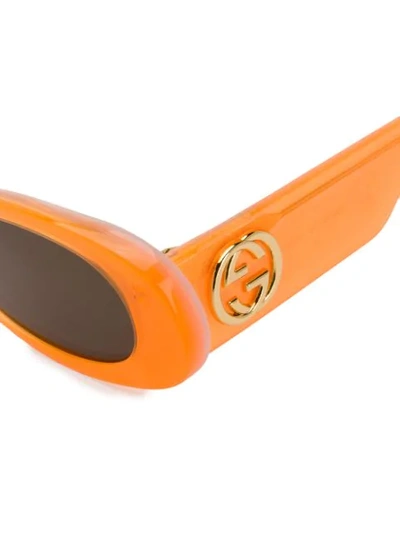 Shop Gucci Round Frame Sunglasses In 005 Orange