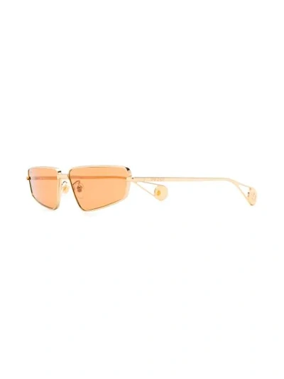 Shop Gucci Tinted Sunglasses In Gold