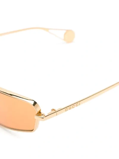 Shop Gucci Tinted Sunglasses In Gold