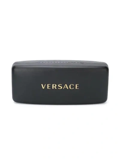 Shop Versace Round Sunglasses In Black
