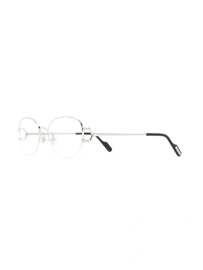 Shop Cartier Oval Frame Sunglasses In Silver