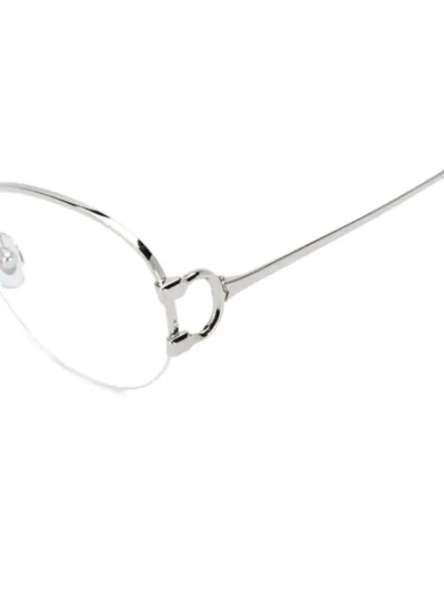 Shop Cartier Oval Frame Sunglasses In Silver