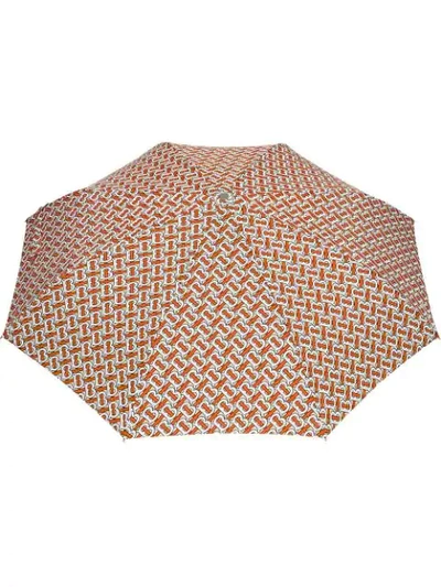 Shop Burberry Monogram Print Folding Umbrella In Orange ,white