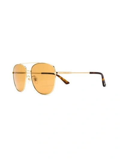 Shop Gucci Navigator Sunglasses In Brown