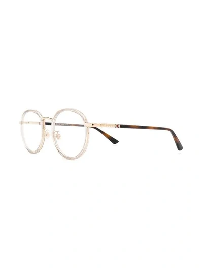 Shop Gucci Round Frame Glasses In Brown