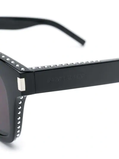 Shop Saint Laurent Studded Sunglasses In Black