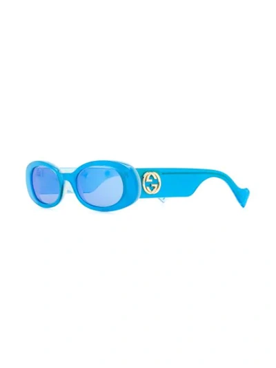 Shop Gucci Oval Frame Sunglasses In Blue