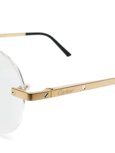 Shop Cartier Rimless Round Shaped Glasses In Gold