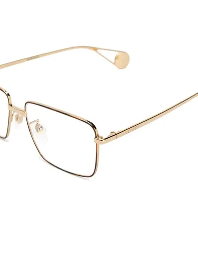 Shop Gucci Rectangle Frame Glasses In Gold