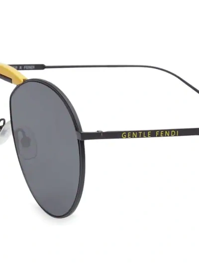 Shop Fendi X Gentle Monster Round Sunglasses In F15q0-matte Black+yellow
