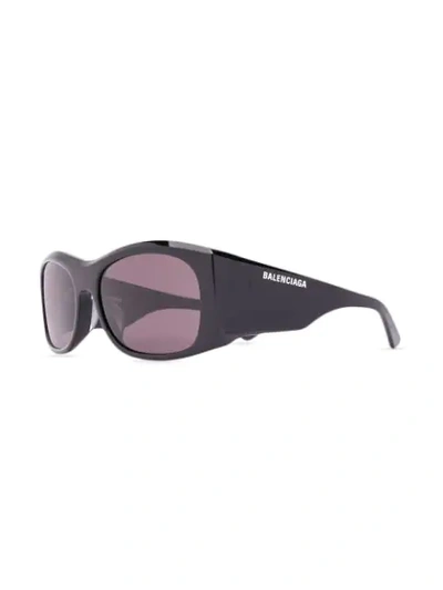 Shop Balenciaga Thick Logo Print Sunglasses In Black