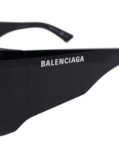 Shop Balenciaga Thick Logo Print Sunglasses In Black