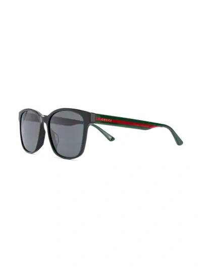 Shop Gucci Striped Sunglasses In 001