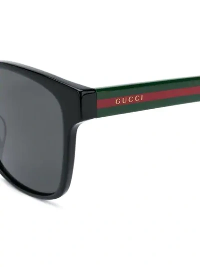 Shop Gucci Striped Sunglasses In 001