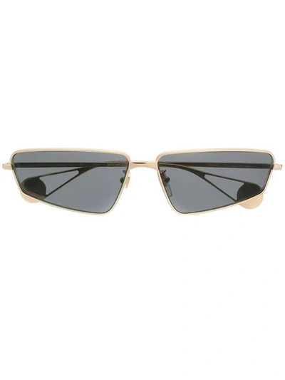 Shop Gucci Geometric Frame Sunglasses In 001 Gold Gold Grey