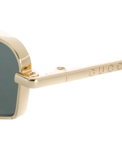 Shop Gucci Geometric Frame Sunglasses In 001 Gold Gold Grey